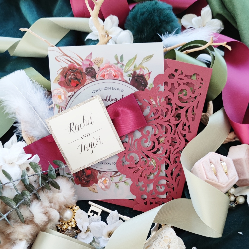 UV printed wedding invite paired with an envelope style lasercut design finished with a thick ribbon and tag.