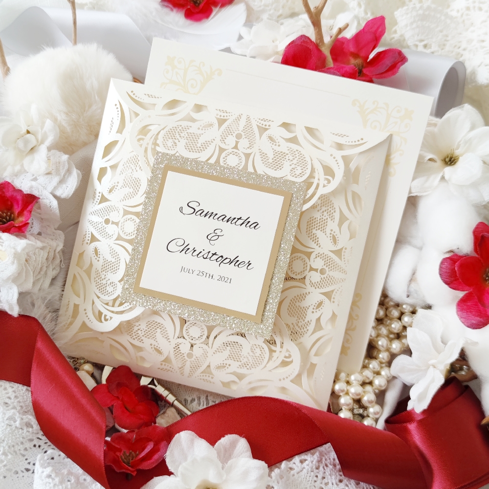 Ivory shimmer four flap lace cut with a three layer tag on the cover opens to reveal the wedding invitation card.