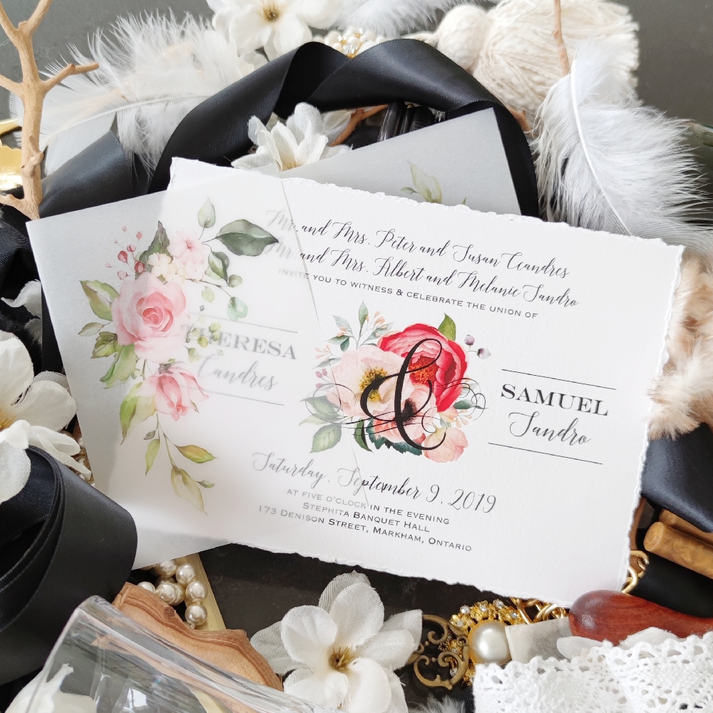 The base of the invite is a deckle edged card which is set up landscape and it is placed in a vellum gate wrap with pink flowers printed.