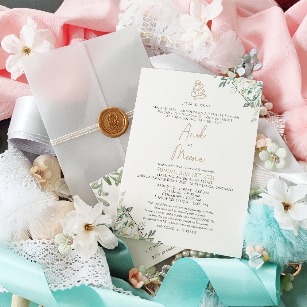 Vellum wrapped wedding invitation in Markham with foil print and wax seal.