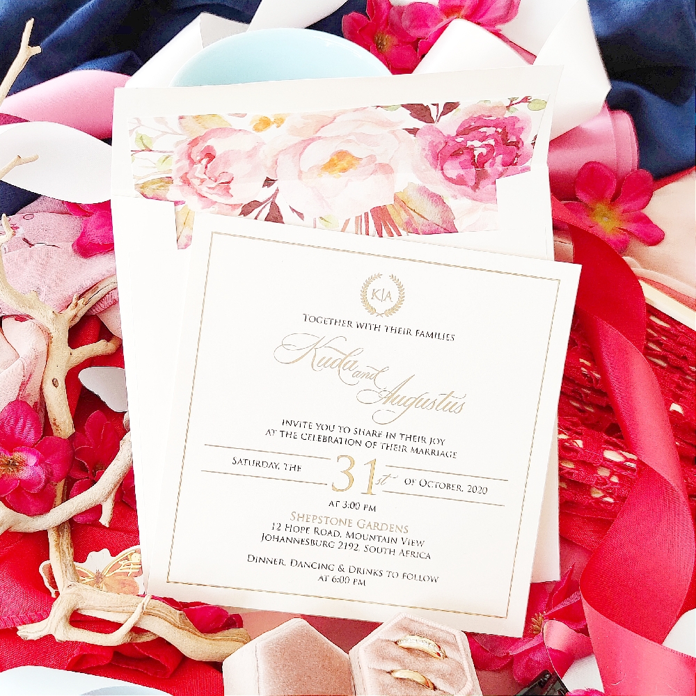 Gold Foil stamped wedding invite with a cream envelope that has a floral printed envelope liner.