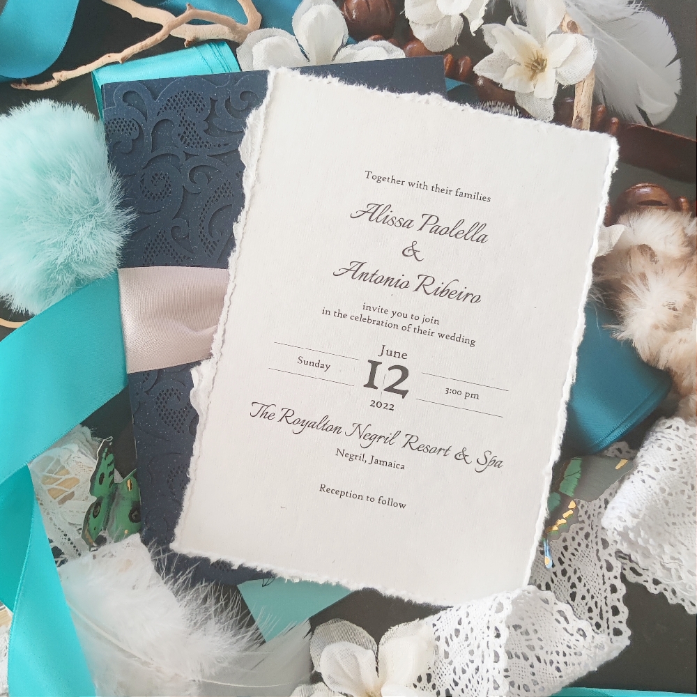 Deckle edge wedding invite on a white paper with a classic layout.