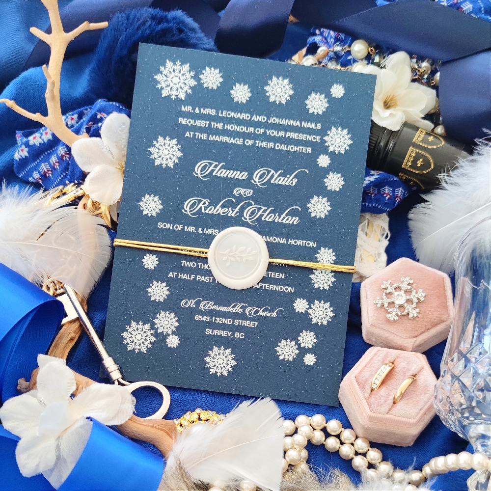 This invitation card uses UV method of print and has an added gold elastic and ivory wax seal.