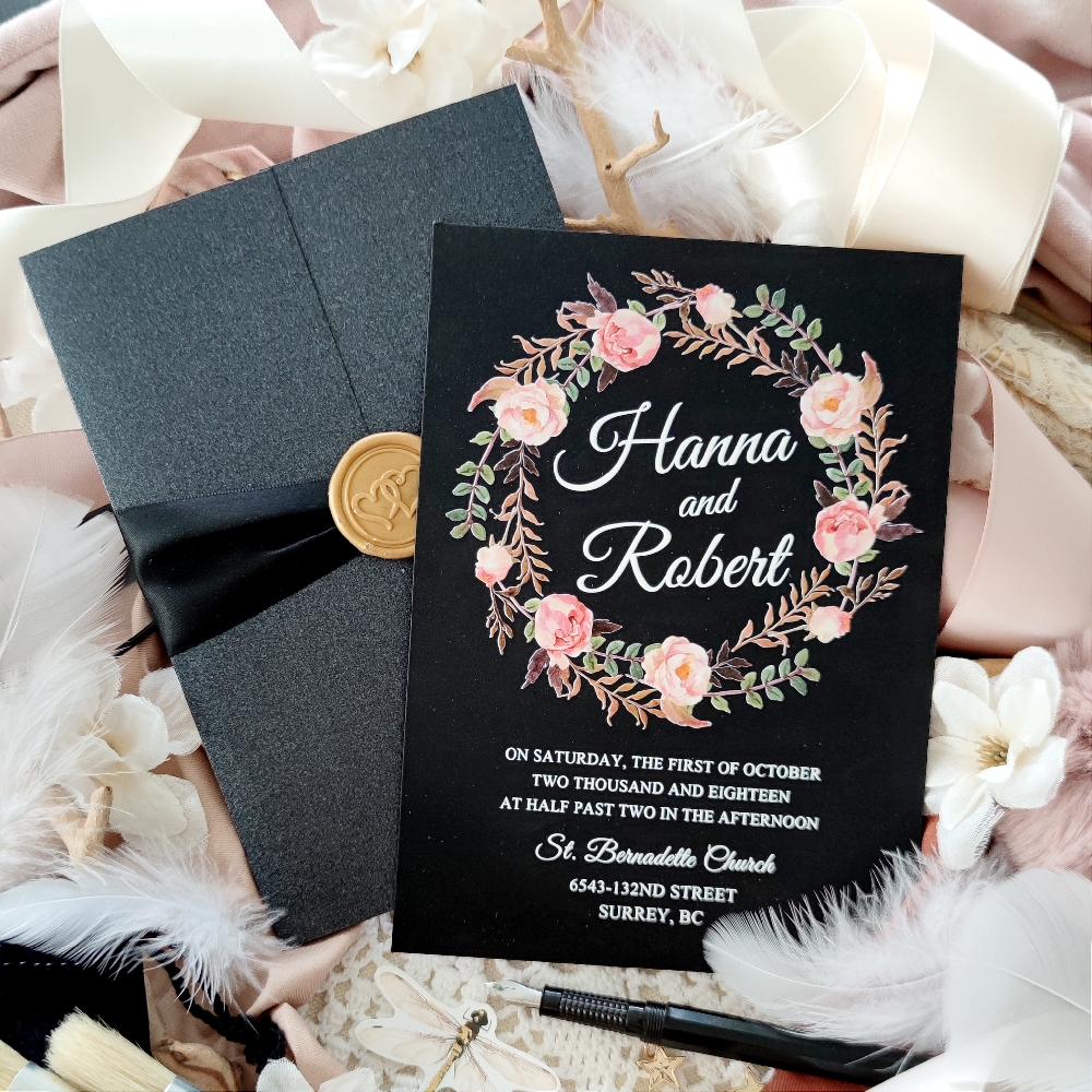 Two different ways to have black wedding invitations.  Black gatefold with ribbon and black paper invitation with white and floral print.