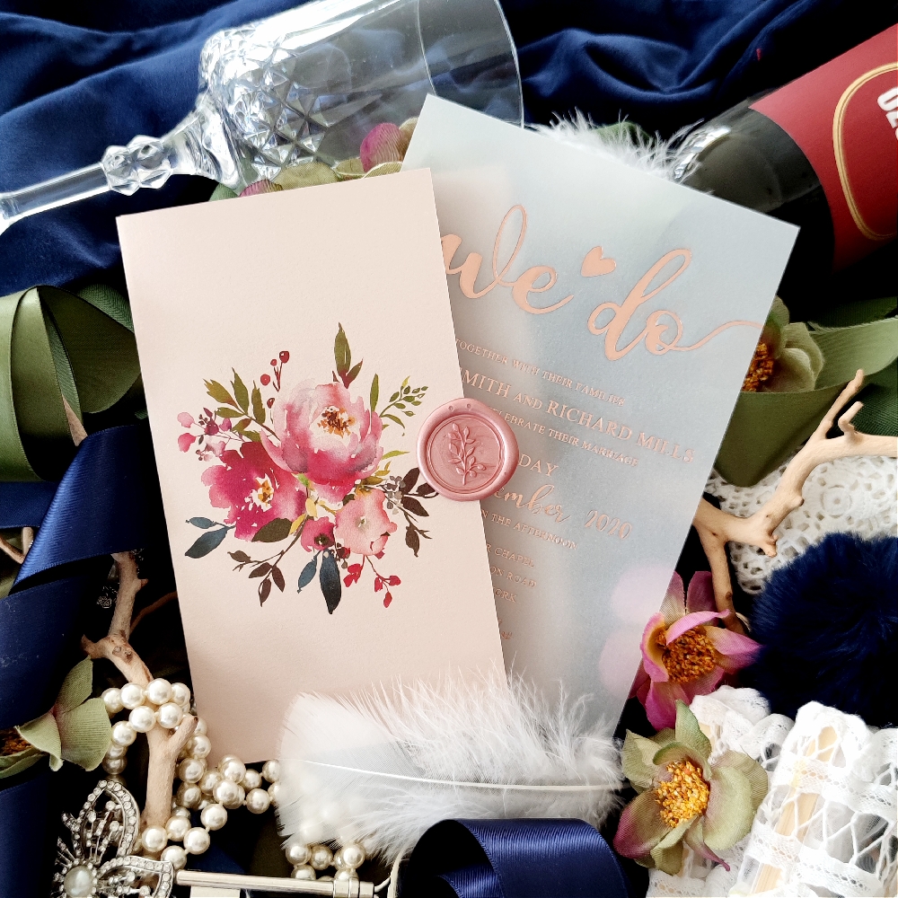 A blush pocketfolder invitation paired with a rose gold UV printed wedding invitation.