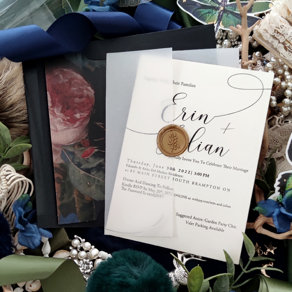Erin & Julian created a single card invite with a vellum wrap and gold wax seal.
