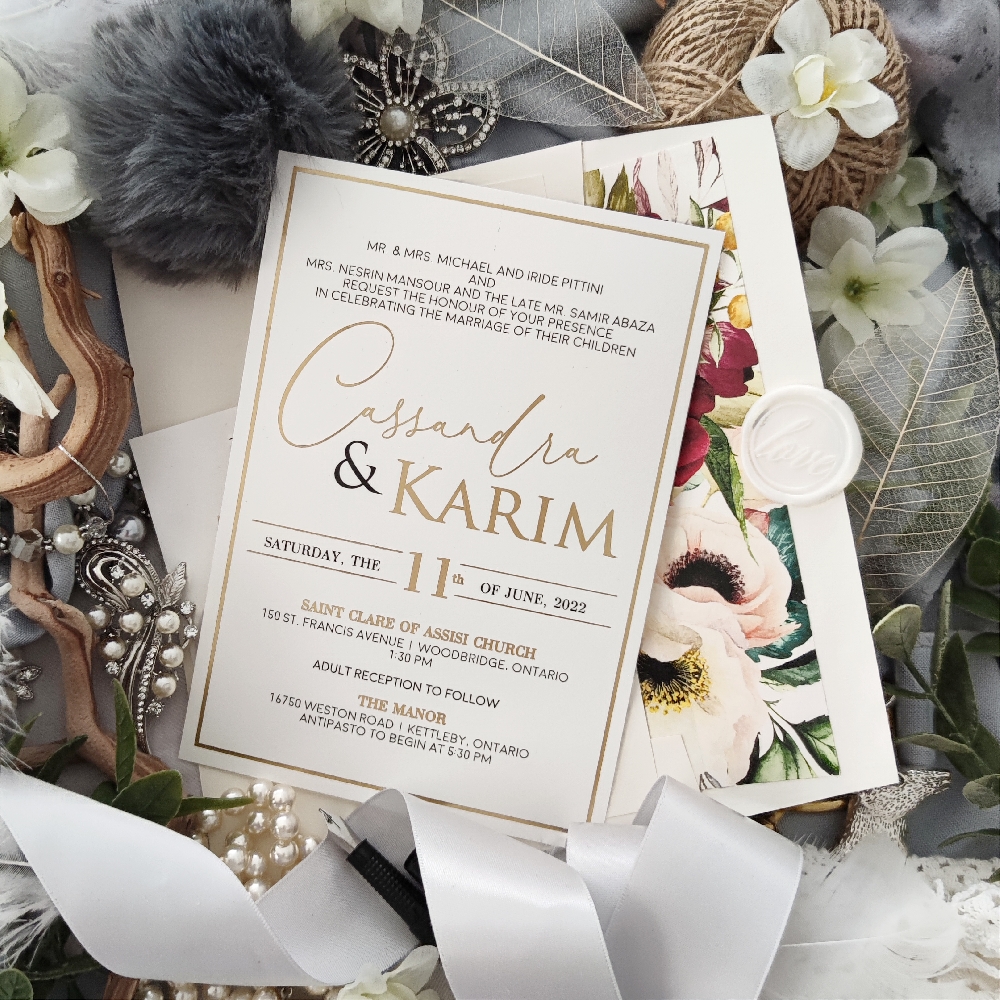 Cassandra & Karim created a gold foil stamped wedding invite with a floral lined envelope.