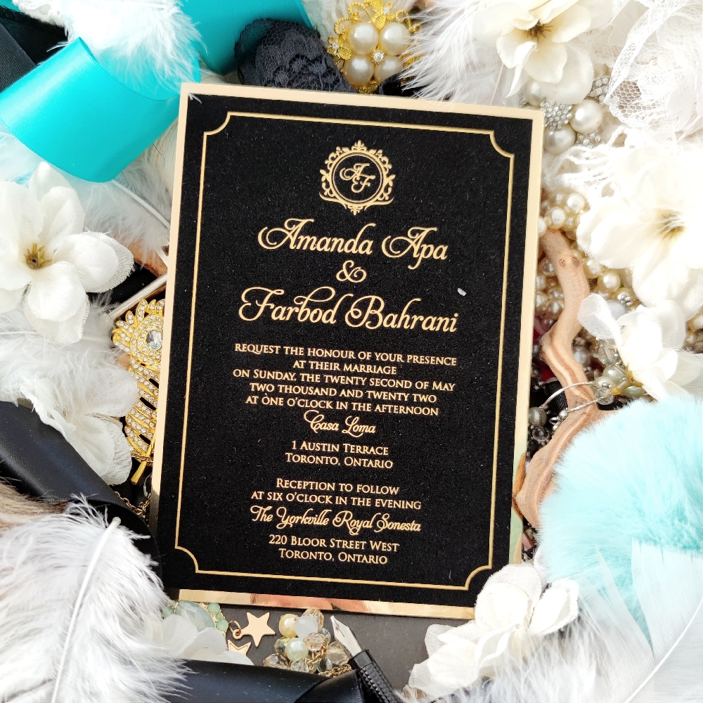 Amanda & Farbod went with a gold foil stamped wedding invitation printed on a black velvet paper.  There is a extra layer of gold mirror paper at the back.