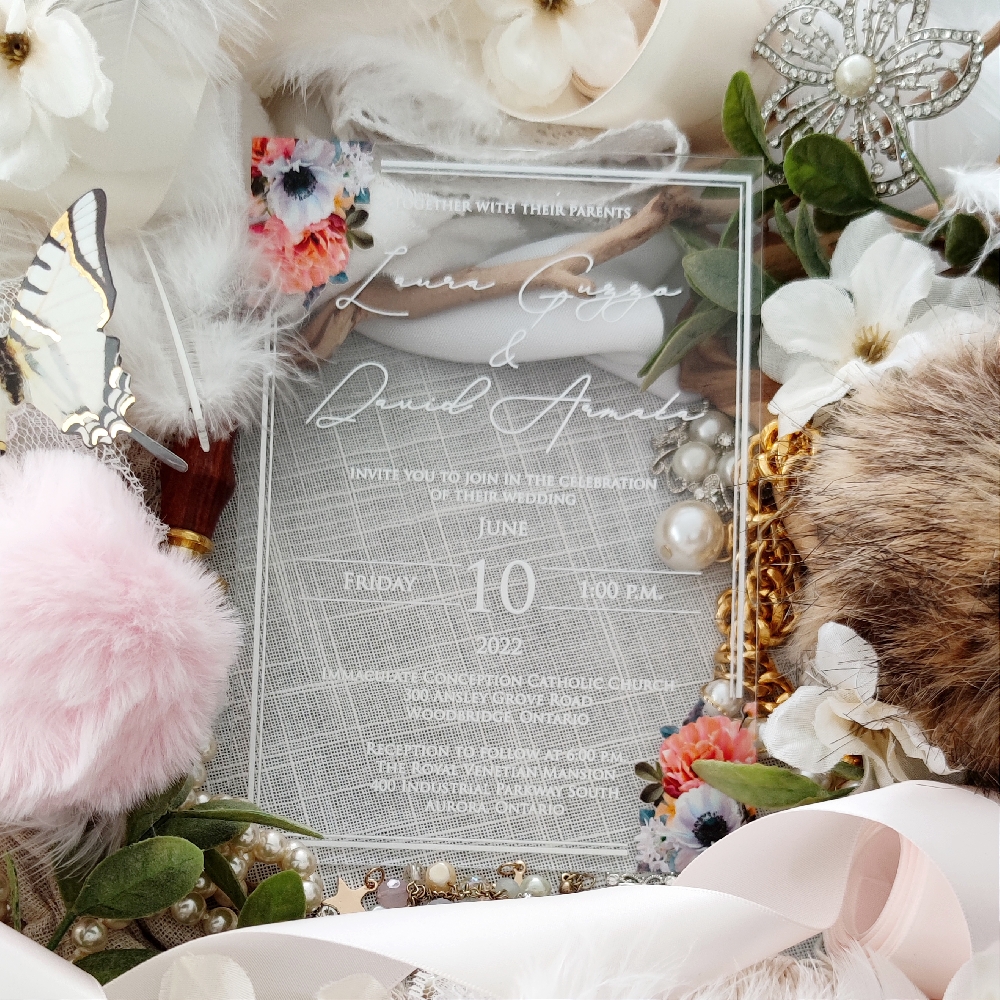 Laura & David went with a modern look with a 2 mm clear acrylic wedding invitation.  There is a modern double line border and all the print is in white UV ink.