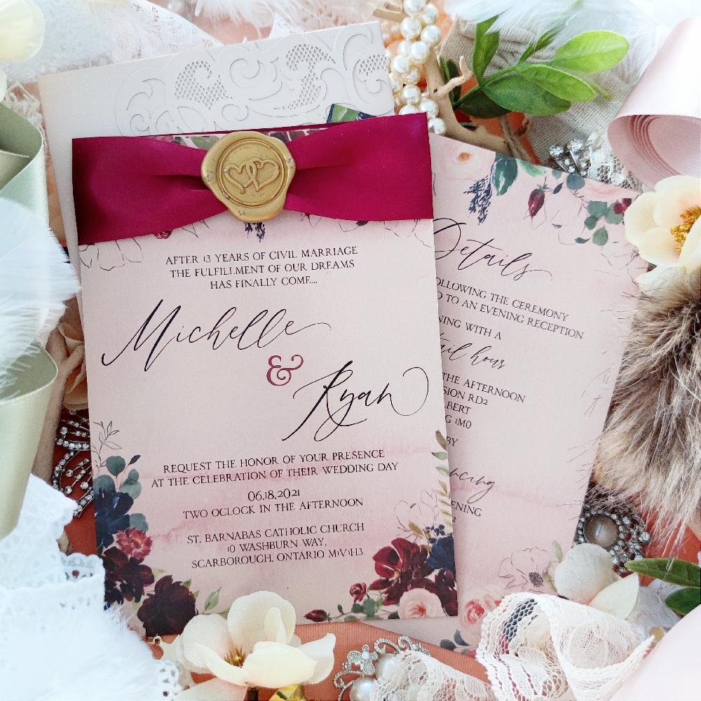 Michelle & Ryan went with the single card design that is embellished with a sherry satin ribbon with a gold wax seal.  The paper they used was a light pink pearl.  There is a double heart design on the wax stamp.