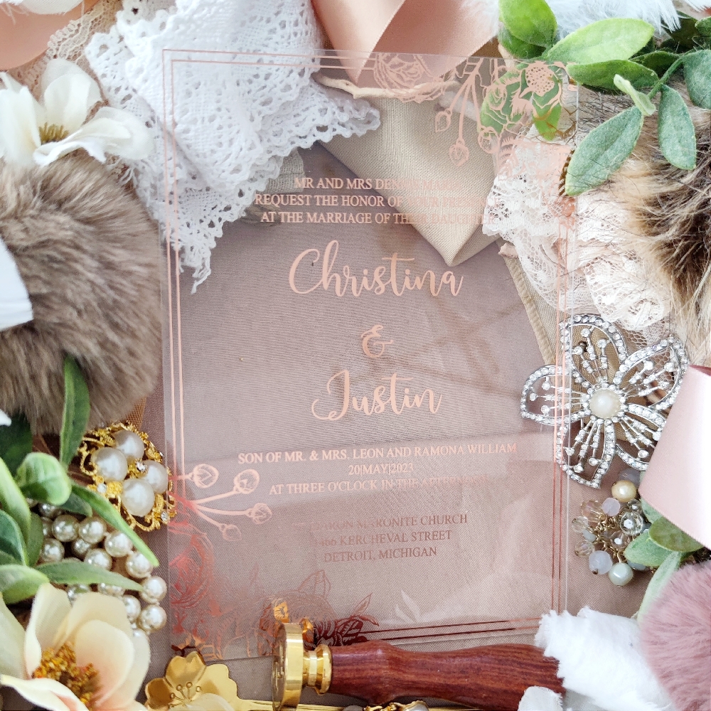 Christina & Justin opted for the wow factor for their wedding cards.  They went with a clear 2 mm acrylic wedding invite.  They had a modern layout design printed with a rose gold screen print.
