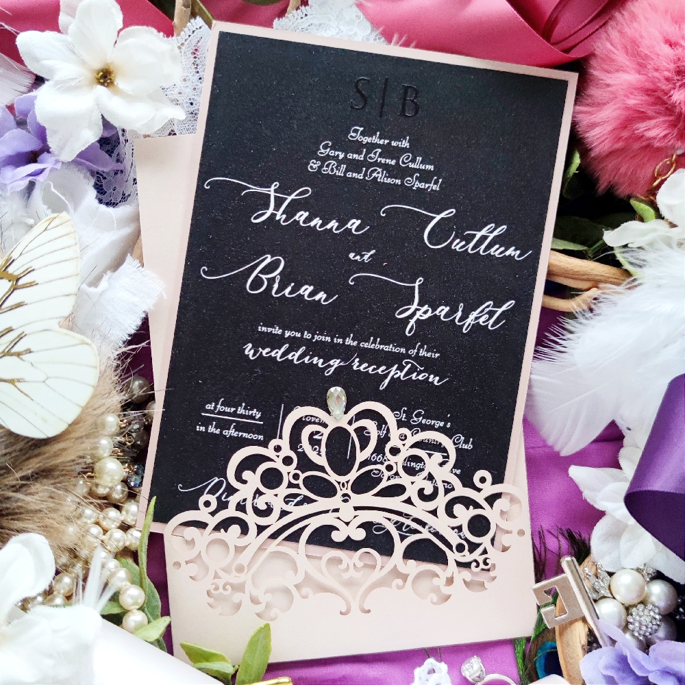 Shana & Brian went with a full black wedding invite look with white ink text.  The main insert is place into a blush shimmer last cut pocket with a rhinetsone jewel embellishment.