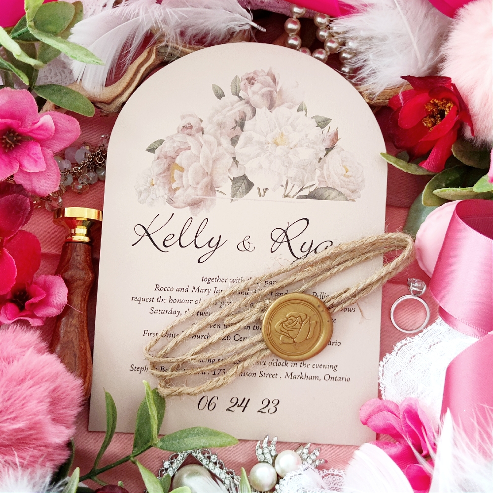 Kelly & Ryan opted for an Arch Wedding Invite cut style.  There is a twine string wrapped around along with a gold wax seal to give it a vintage look.