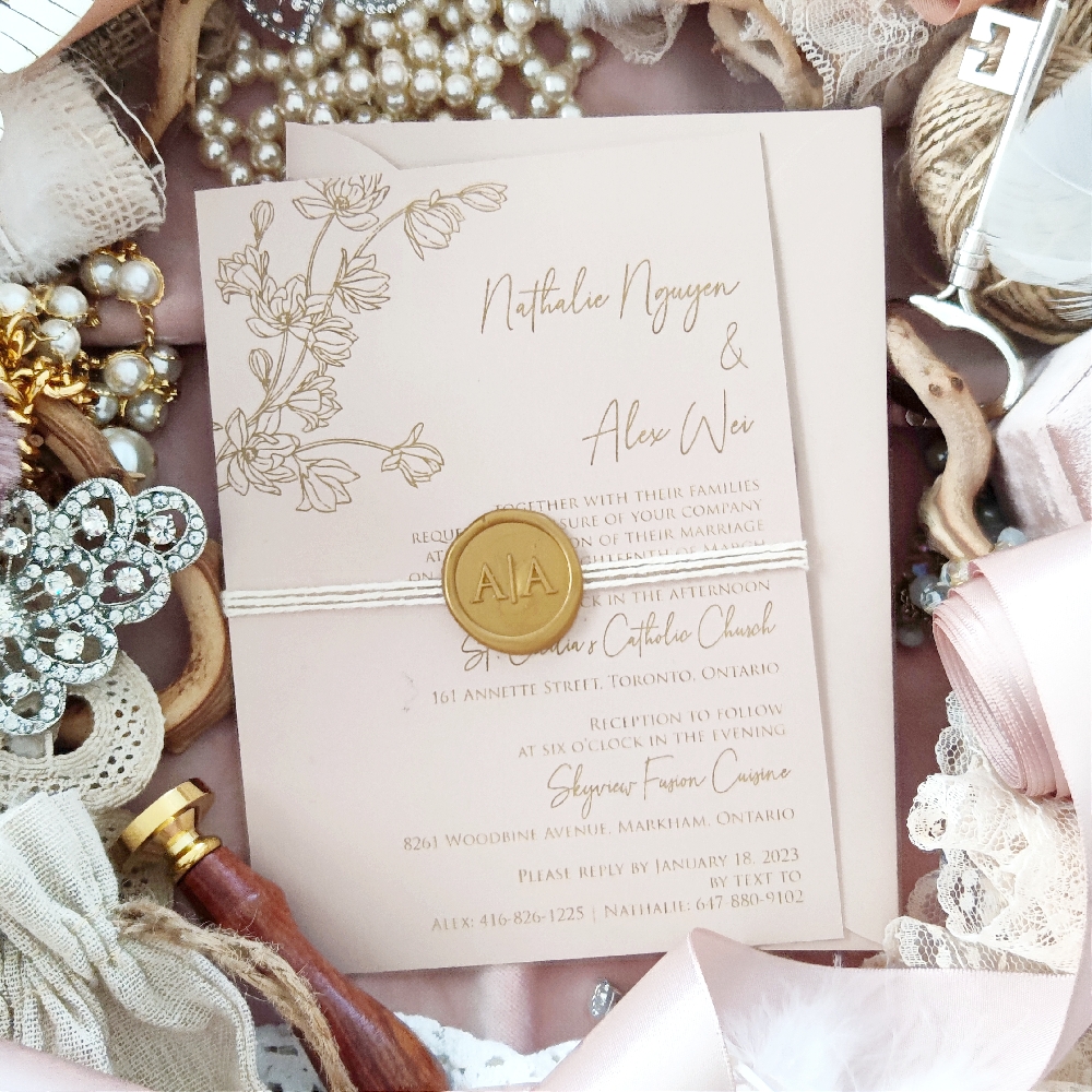 Natalie & Alex went with a single card wedding invitation design wrapped with a string and gold custom wax monogram seal.