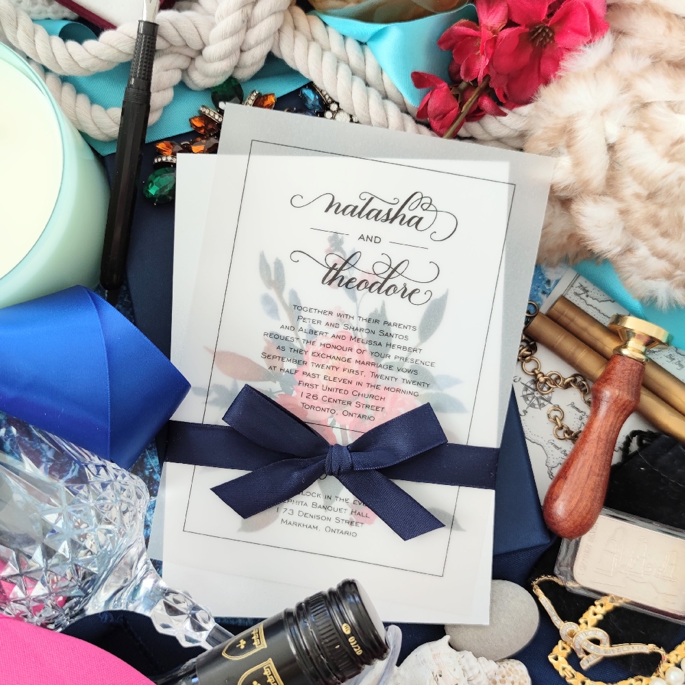 Ice pearl floral card with a vellum overlay and a navy bow to hold the pieces together.