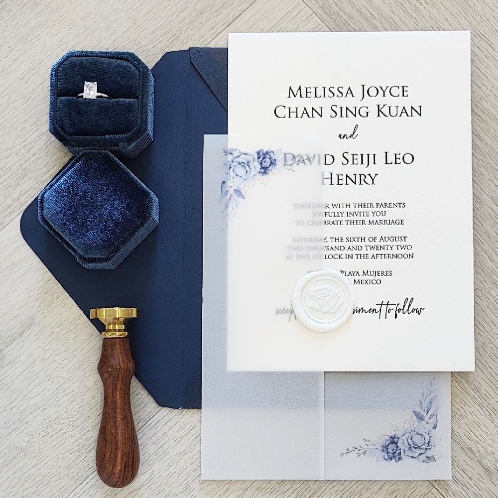 Letterpress Wedding Card in Black ink with a printed full vellum wrap enclosure and white rose wax seal.  Paired with a navy blue envelope.