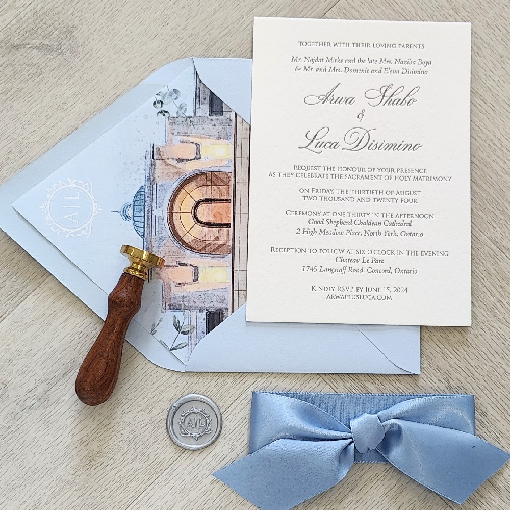 Letterpress Wedding Invitation on White Cotton paper with Charcoal Ink.  Azure Blue mailing envelope with a printed venue sketch envelope liner.