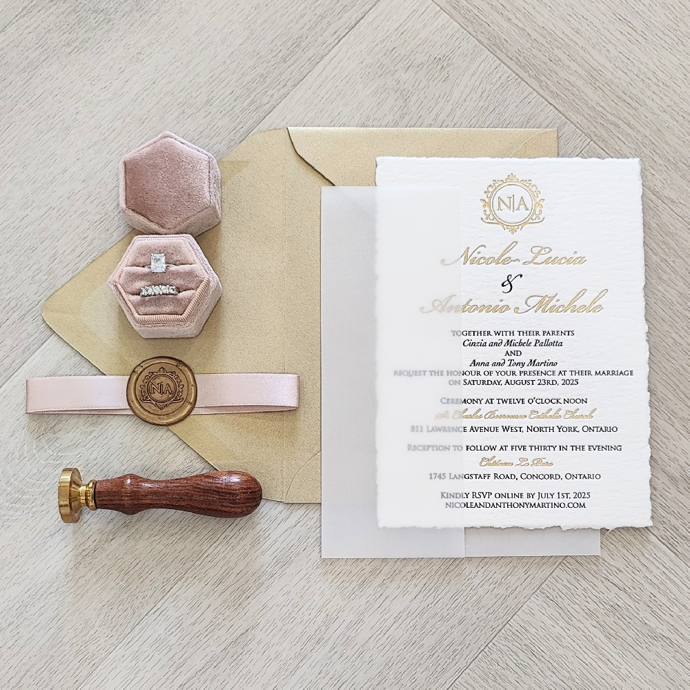 Letterpress Wedding Invite with Deckle Edge.  Full vellum wrap enclosure with blush ribbon and gold custom wax seal.  Metallic gold envelope.  Gold Foil stamp printing on the invitation.