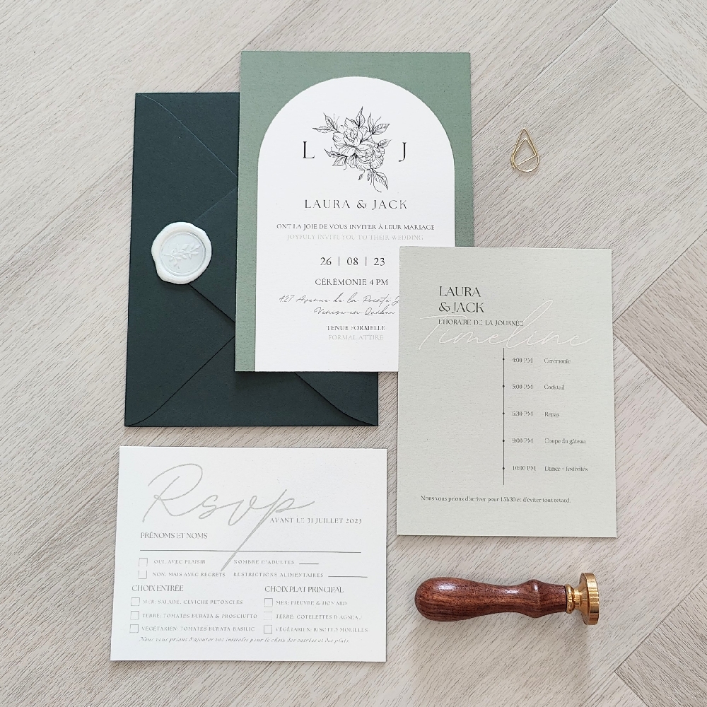 Solid color print wedding invite suite with a green envelope and wax seal.