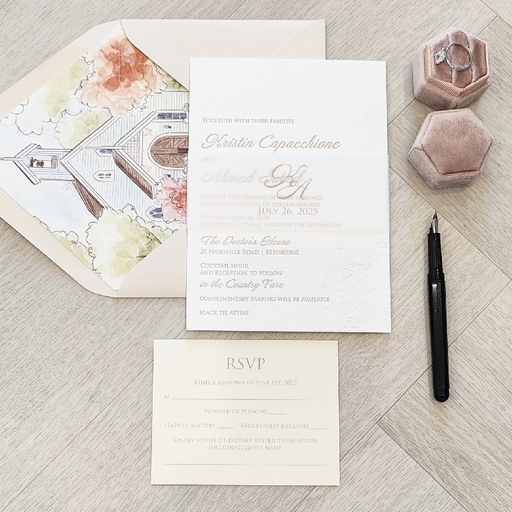 Letterpress invite with a vellum belly band and matching envelope with printed liner design.