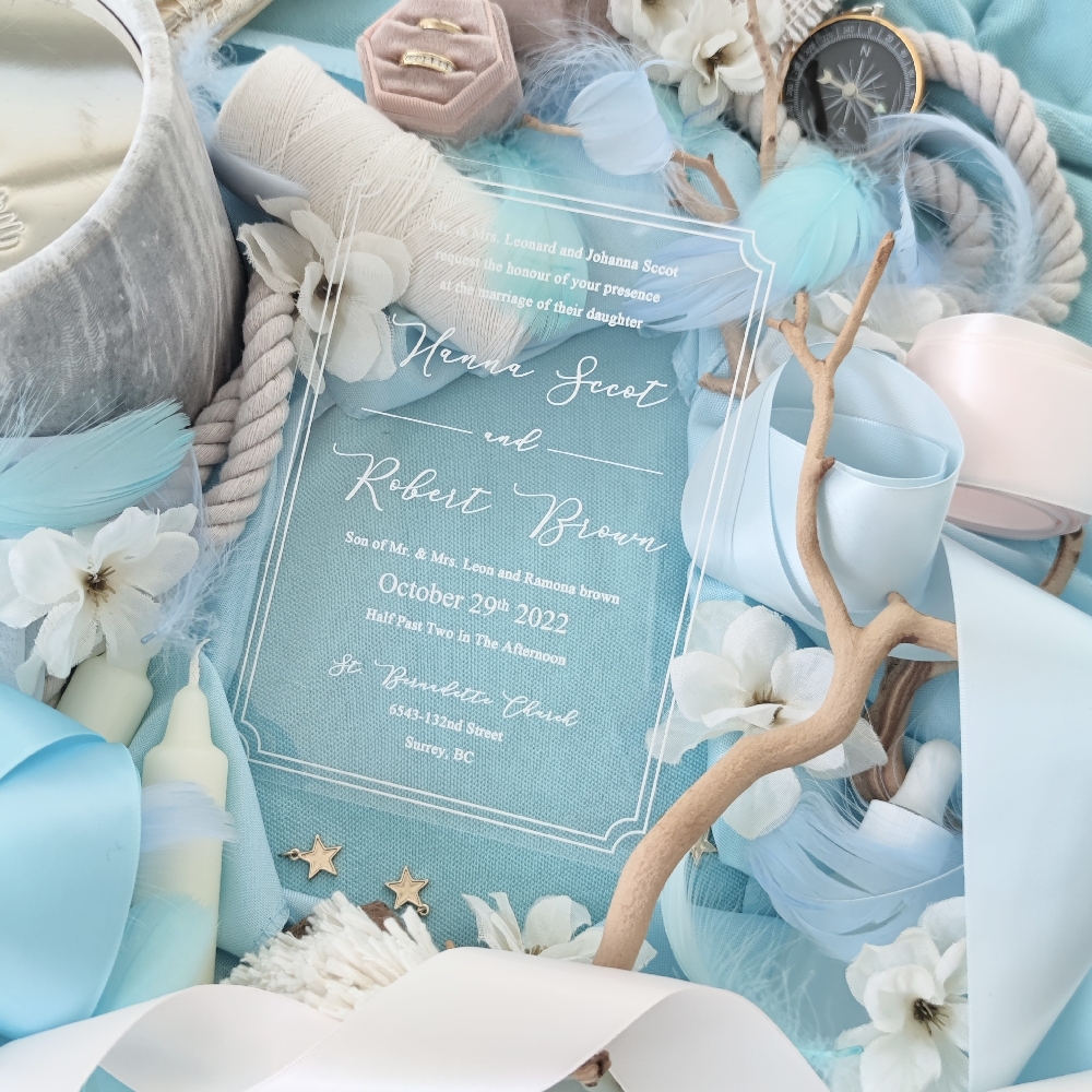 A simple acrylic wedding invitation with white ink printing.