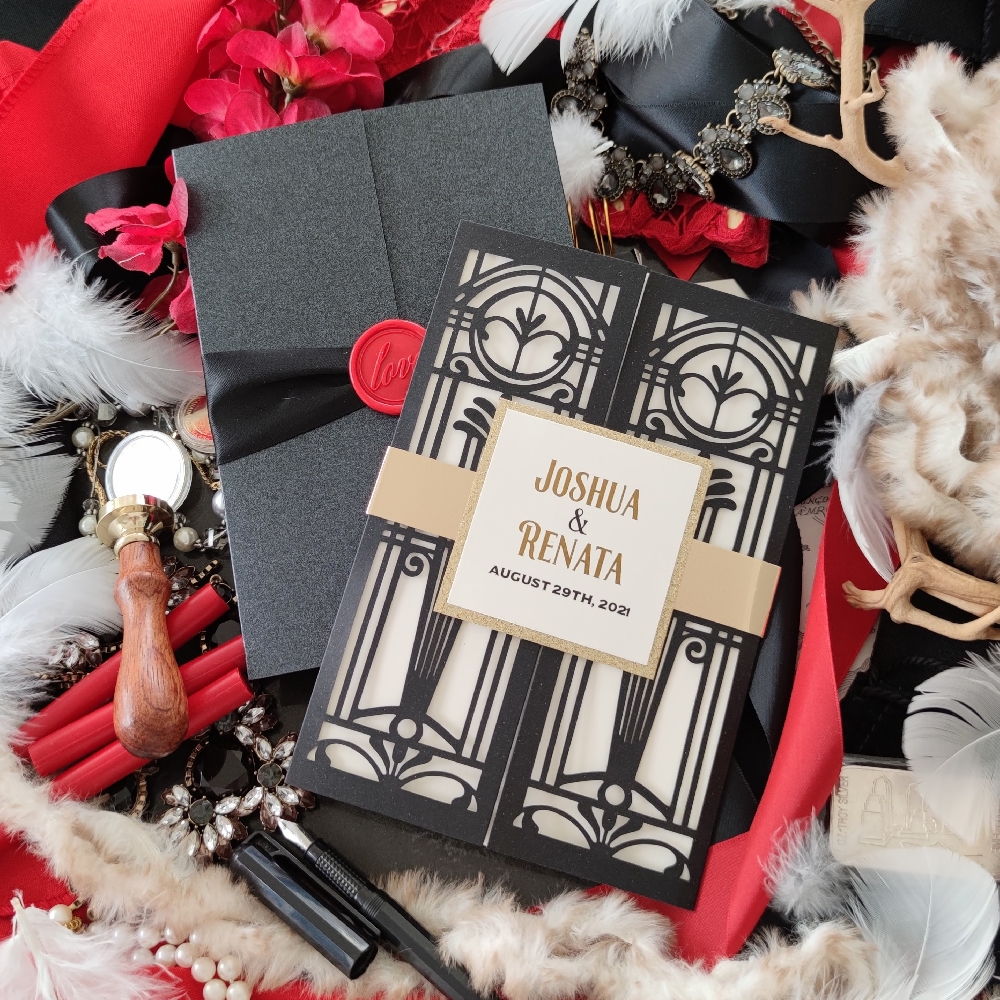 Black lasercut invite with art deco themed gate fold and gold chrome bellyband.