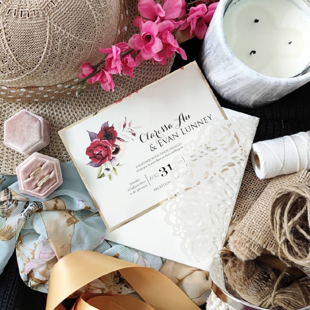 A lasercut wedding invitation pocketfolder with a layered invitation card.