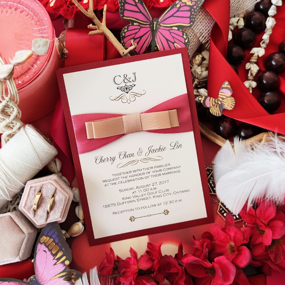 A layered 5x7 card with red laquer matting and red and champagne ribbon detail.