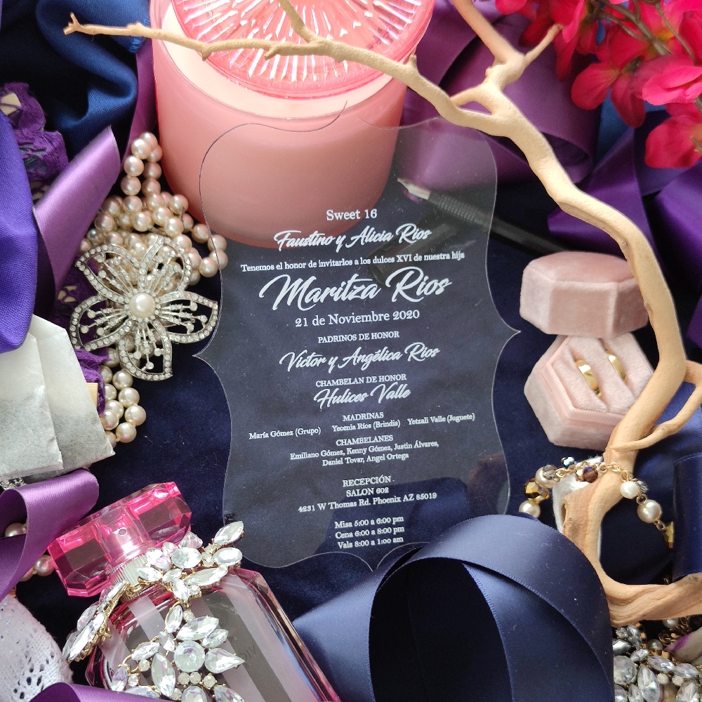 Shaped clear acrylic wedding invitation with white ink.