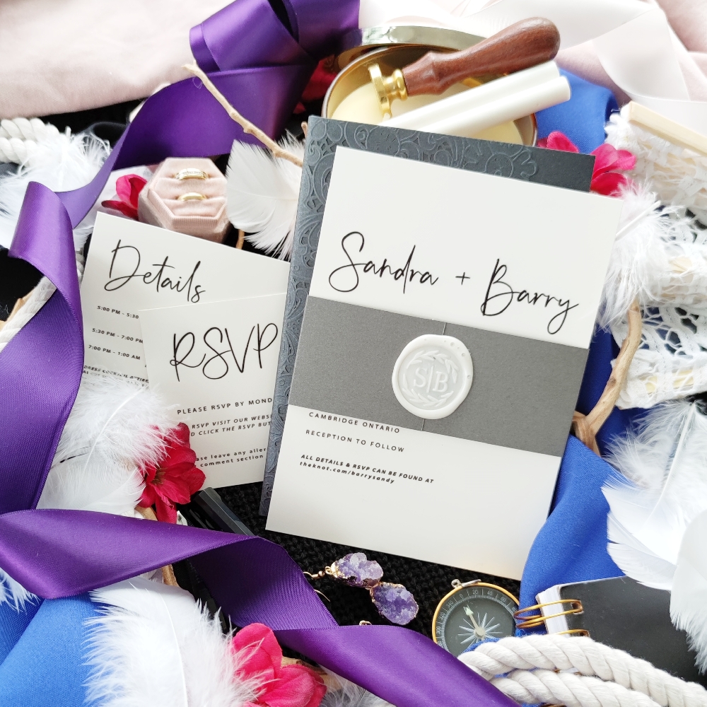 Invitation suite with details card and reply card.  Invitation with bellyband and wax seal.