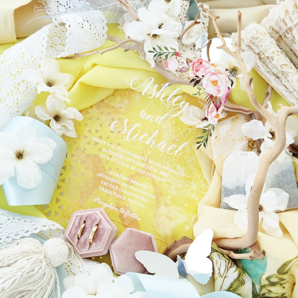 Clear acrylic wedding invitation with our popular blush and pink flowers printed at the top right corner.