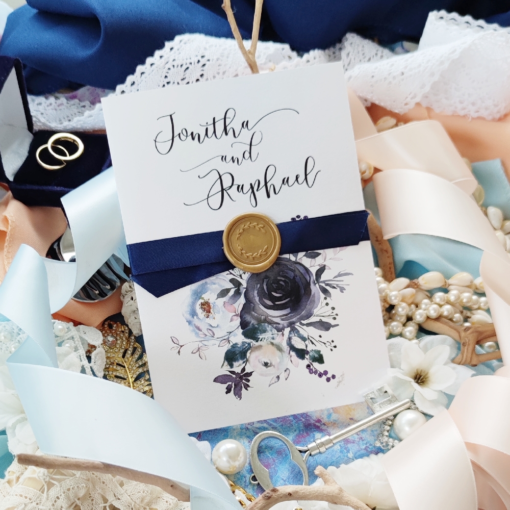 Pocketfold wedding invitation with an added ribbon and wax seal upgrade.