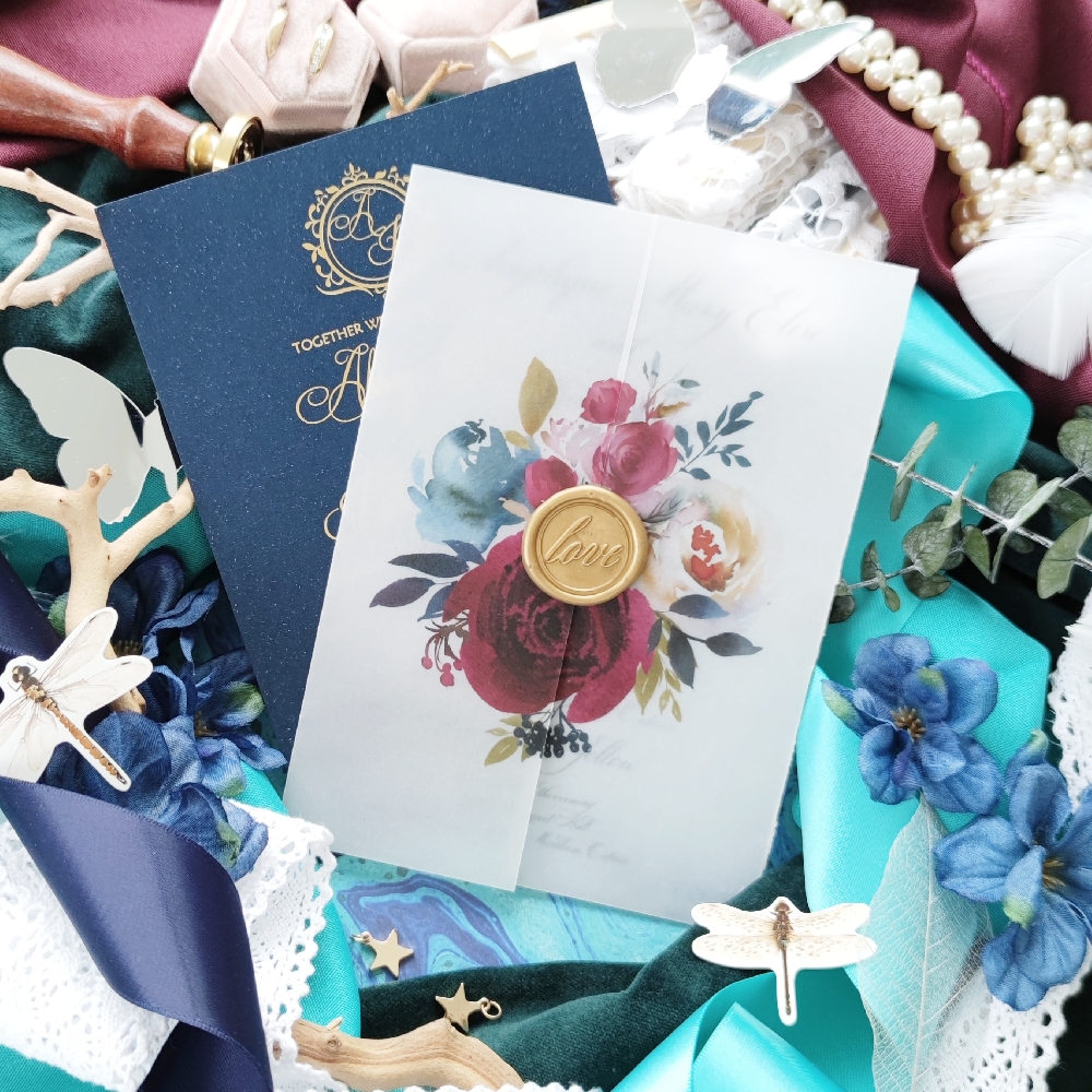 Invitation card printed directly on vellum gate fold with gold wax seal.