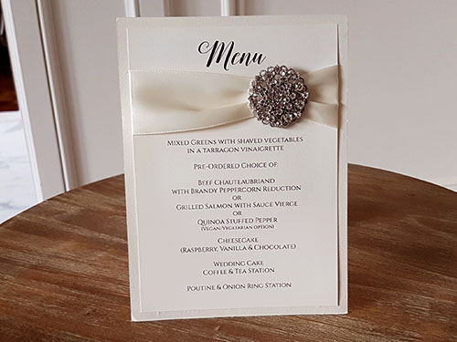Menu M18: White Gold, Antique Ribbon, Brooch/Buckle X - Tent style menu with a menu and brooch design.  Printing is available on both sides of the menu.