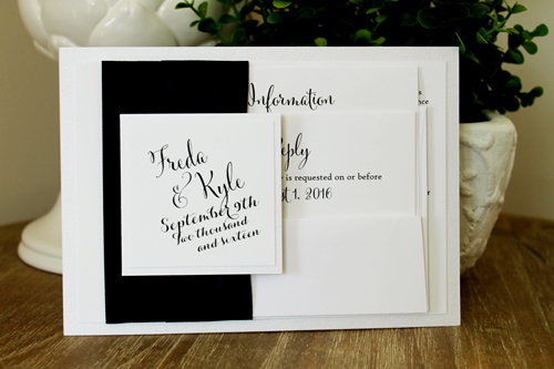 Invitation 1518: Black and white invites can look very sharp.  This invite has thick black ribbons on the side contrasted with white paper below and white tag on the black ribbon.
