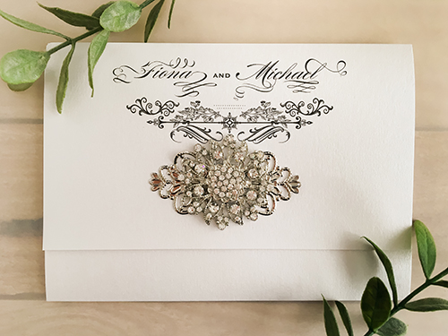 Invitation 1603: Ice Pearl, Ice Pearl, Brooch/Buckle A11, Metal Filigree F4 - Silver - This is an ice pearl pocket fold wedding invite with a combo brooch design on cover flap. Invitation 1603: Ice Pearl, Ice Pearl, Brooch/Buckle A11, Metal Filigree F4 - Silver - This is an ice pearl pocket fold wedding invite with a combo brooch design on cover flap.
