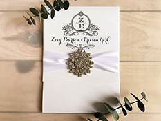 Invitation 1687: Ice Pearl, Ice Pearl, White Ribbon, Brooch/Buckle A11 - This is a 3/4 flap ice pearl wedding invite pocketfolder.  There is a white ribbon and brooch on the cover flap.