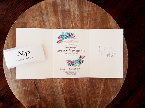 Invitation 2027: White Gold, Cream Smooth - This is a full flap pocketfold invitation design with a belly band wrapped around.  There are floral prints on the cover flap.