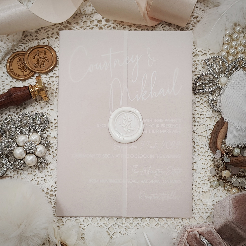 Invitation 3705: Blush Pearl, Ivory Wax - White ink printing on blush pearl paper with clear vellum wrap and ivory wax seal.