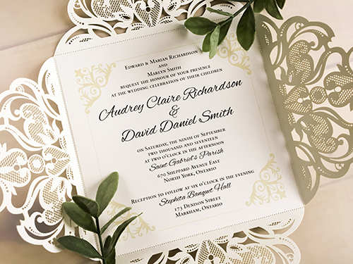 Invitation lc105: Glitter Silver, Silver Mirror - This a four flap silver glitter laser cut wedding invite.  There is a silver mirror layered cover tag.