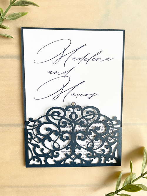 Invitation lc162:  - This is a navy shimmer lasercut wedding invitation with a small rhinestone decorative piece.  The invitation card pulls out of the pocket.