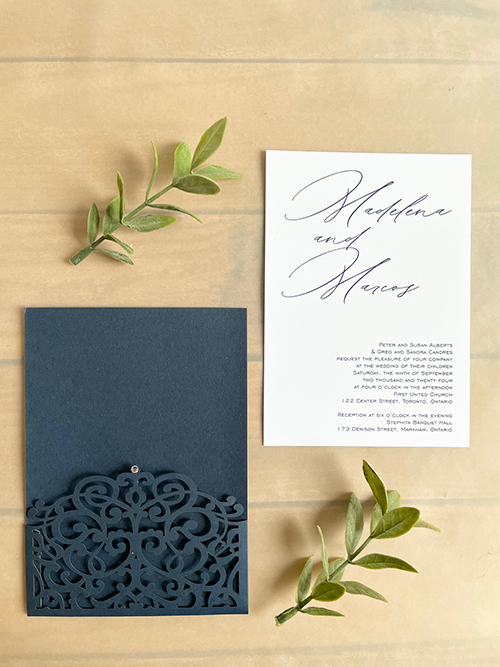 Invitation lc162:  - This is a navy shimmer lasercut wedding invitation with a small rhinestone decorative piece.  The invitation card pulls out of the pocket.