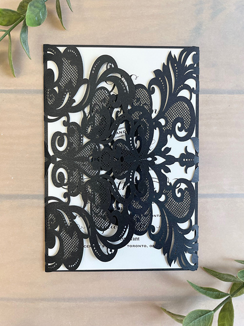 Invitation lc171: Glittering Black, Cream Smooth - This rectangular lasercut opens left and right with the main invitation card in the middle.