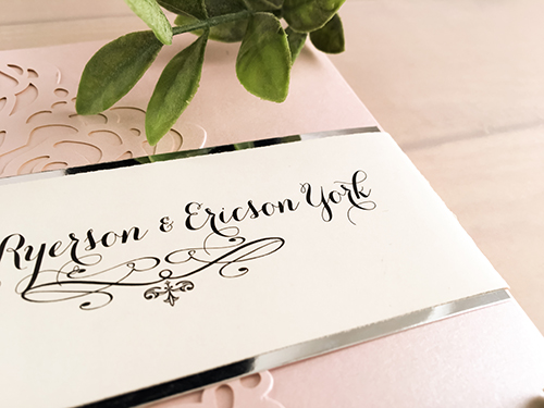 Invitation lc17: Blush Shimmer, Silver Mirror, Cream Smooth - This is a blush shimmer pocket folder laser cut wedding invitation.  The silver mirror layered belly band wraps around the card.