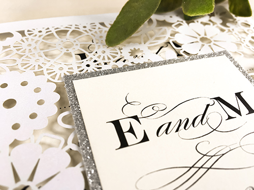 Invitation lc32: White Shimmer, Silver Glitter, Cream Smooth - This is a white shimmer laser cut wedding card.  There is a silver glitter layered cover tag.