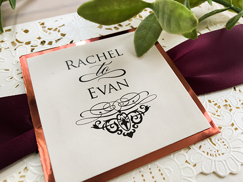 Invitation lc48: Ivory Shimmer, Rose Gold Mirror, Cream Smooth, Eggplant Ribbon - This is an ivory shimmer pocket style laser cut wedding invite.  There is a eggplant ribbon with rose gold mirror cover tag.
