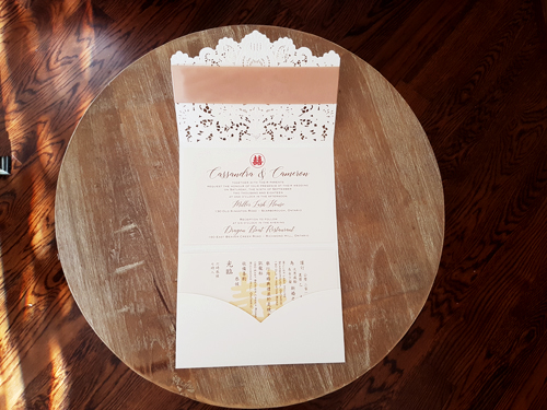 Invitation mb11: Ivory Shimmer, Gold Mirror, Cream Smooth, Champagne Ribbon - This is a pocket style laser cut folder in the ivory shimmer color.  There is a champagne ribbon wrapped around the cover and layered cover tag.