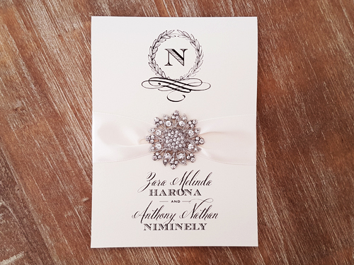 Invitation mb18: White Gold, Antique Ribbon, Brooch/Buckle A11 - This is a vertically opening pocketfold invitation with an antique ribbon with a large floral brooch.