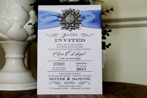 Invitation 1305: Orchid Pearl, Periwinkle Ribbon, Brooch/Buckle A11, Metal Filigree F5 - Silver - Orchid pearl paper with a periwinkle ribbon and brooch design