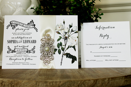 Invitation 1331: White Smooth, Antique Ribbon, Brooch/Buckle Q, Metal Filigree F4 - Silver - Flower printed white paper with a neutral ribbon and brooch design